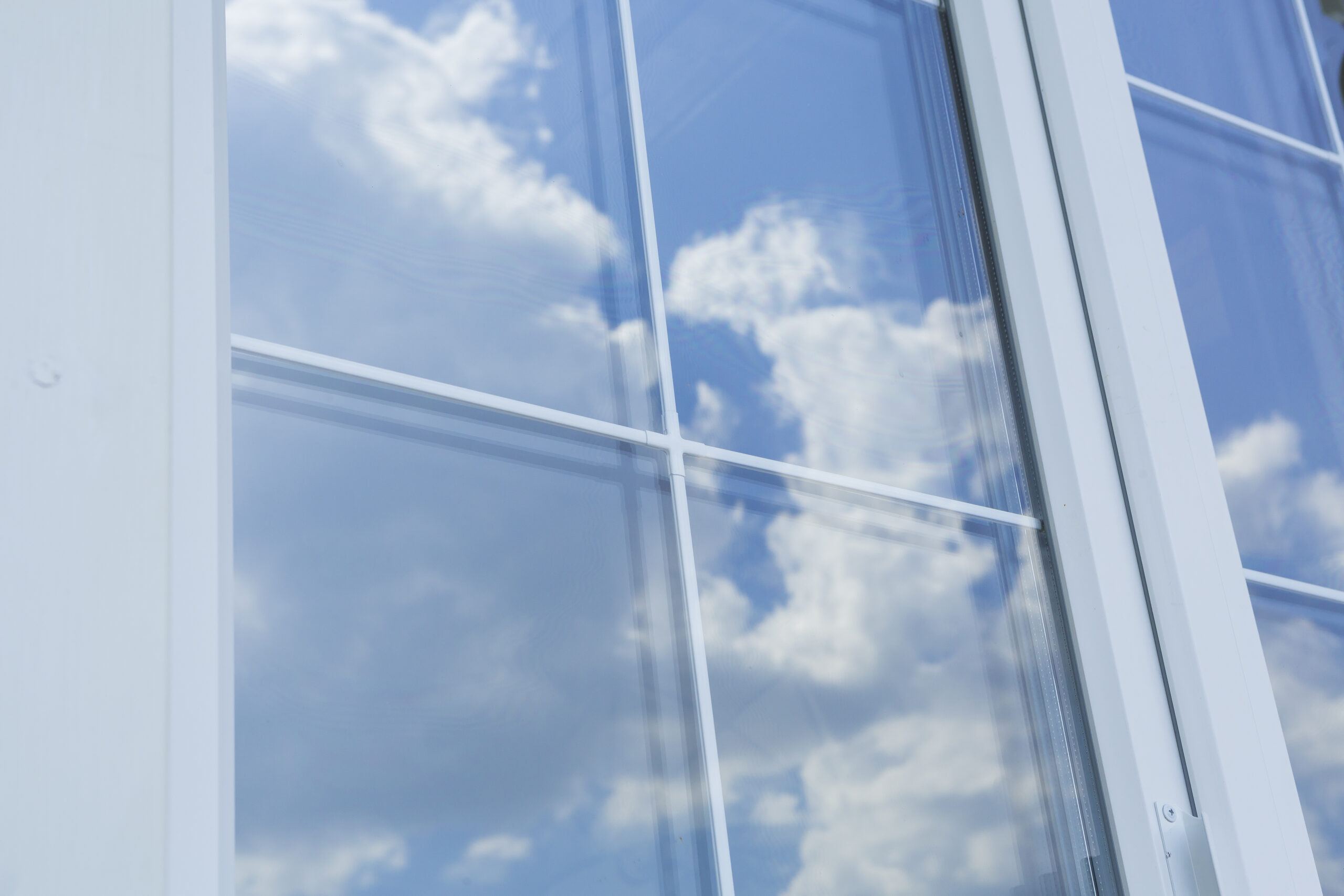 Clean window with sky reflection